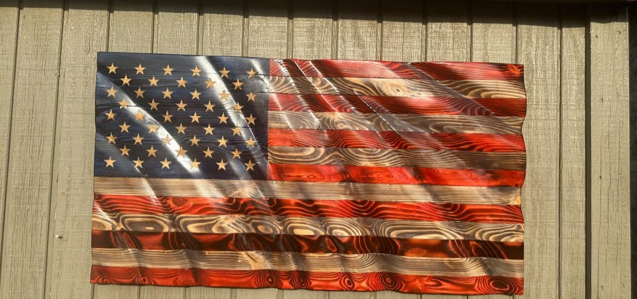 Custom wooden American flag in sunlight, rippled like it's waving